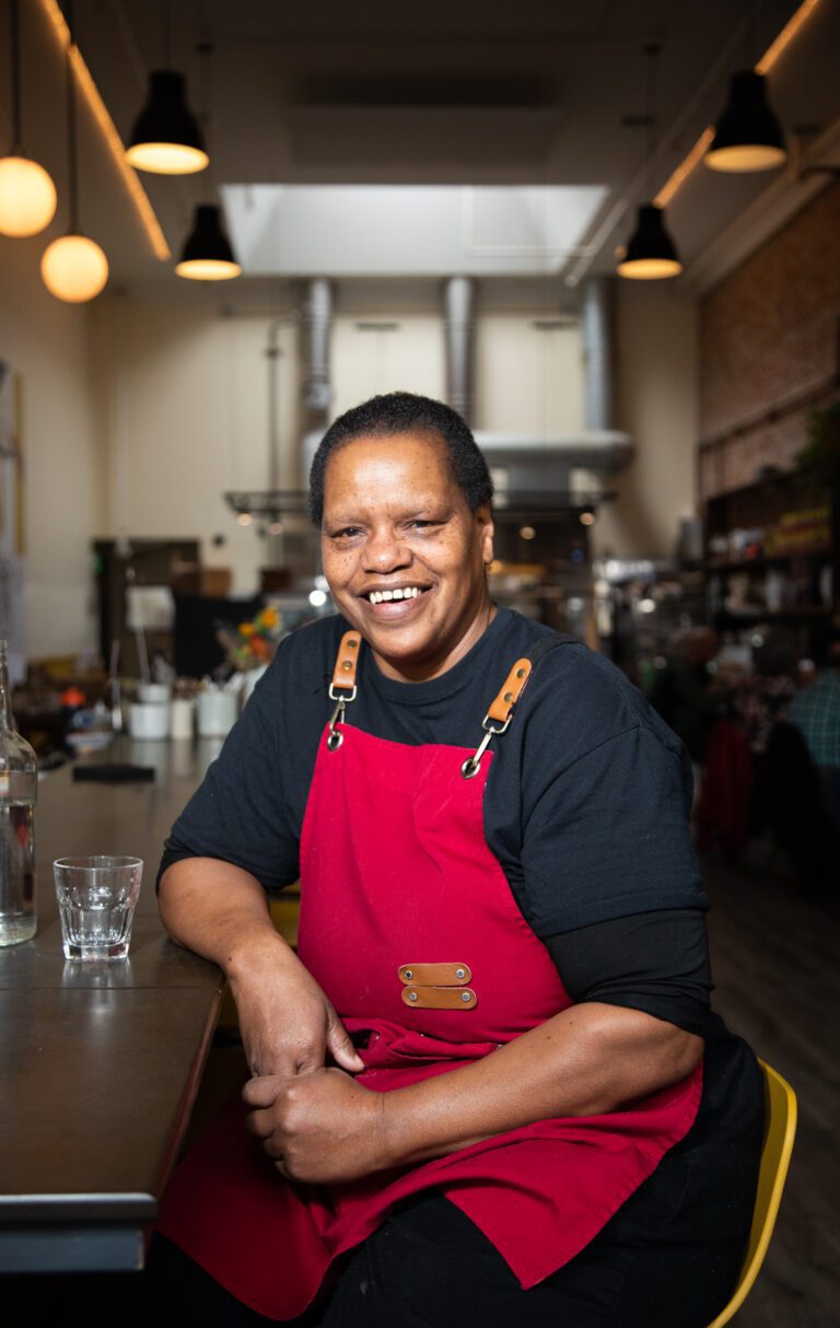 Helen Lofton, the chef de cuisine at Storia Cucina, inside the restaurant with their elbow on the counter.