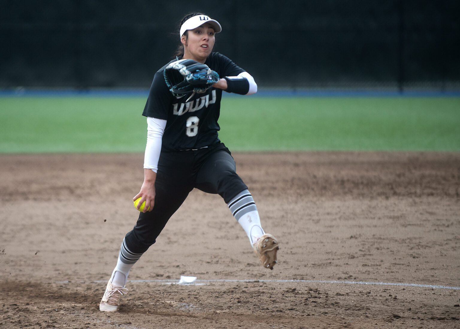 Western Washington University senior pitcher Mareena Ramirez starts walking as they are about to pitch the wall.