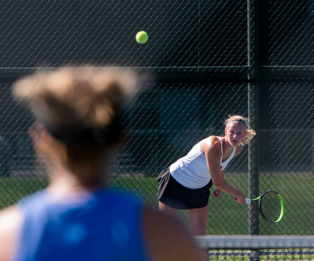 Bellingham's Ellie Wolverton serves the ball to Squalicum's Bernadine Salvatierra May as she maintains her focus on the ball.