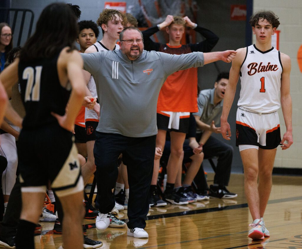 Explaining he was calling for a timeout, Blaine head coach Nate Sullivan reacts with an expression and his arms spread wide.