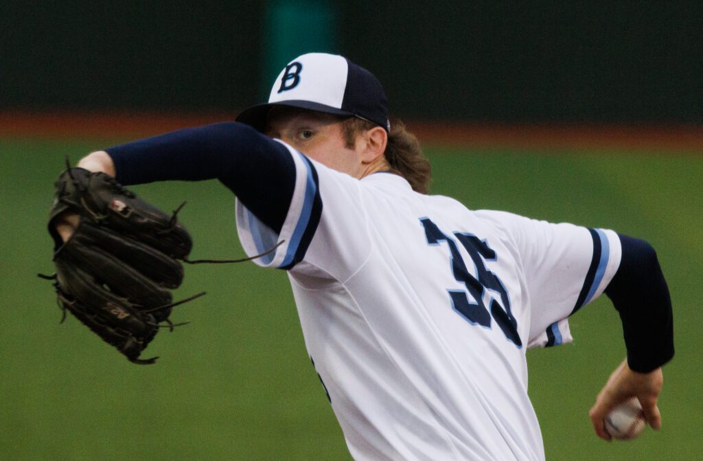 Trevin Hope keeps an eye on the strike zone right before delivering a pitch.