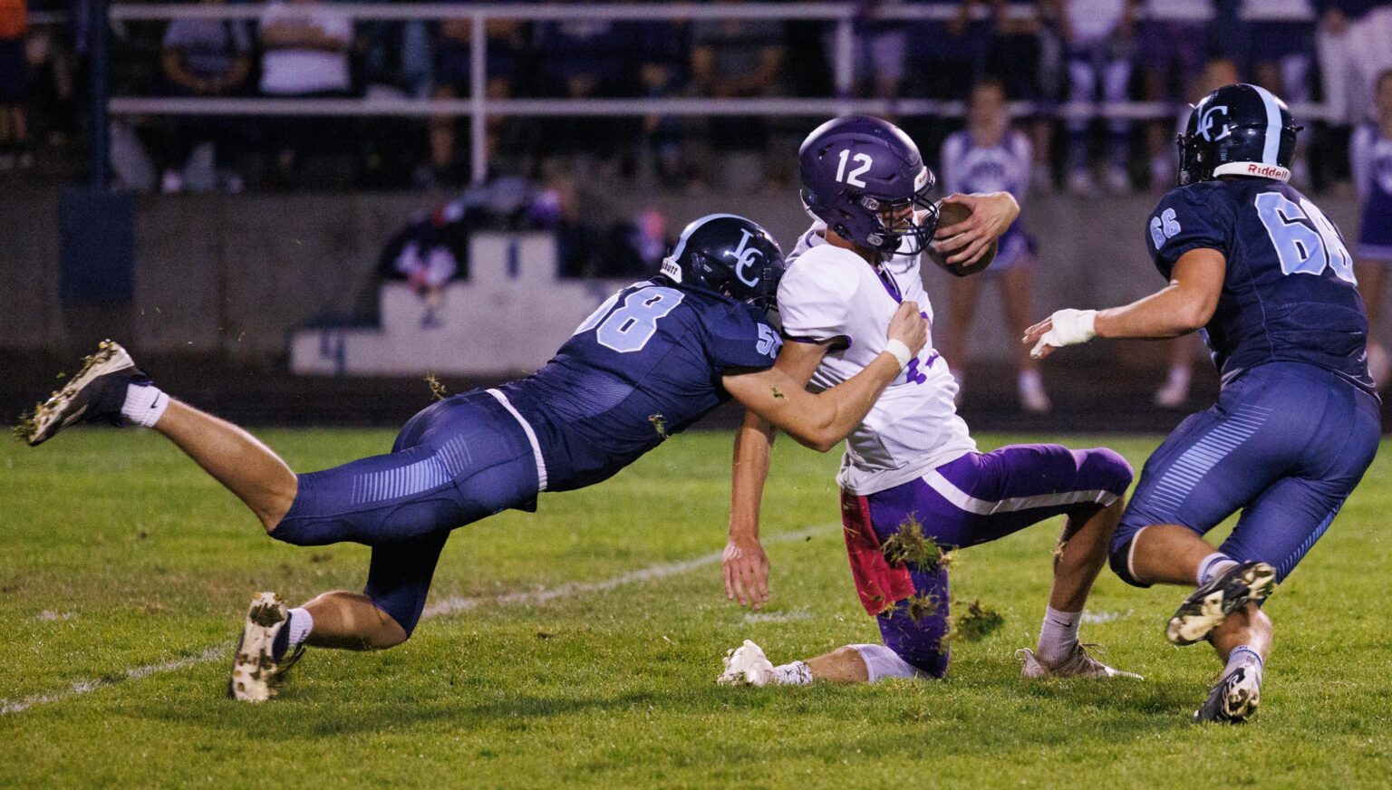 Lynden Christian's Tyler Myhre sacks Nooksack quarterback Joseph Brown by grabbing him from the back.