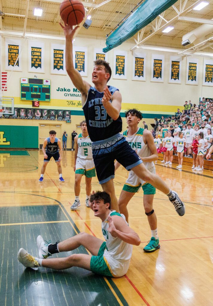 Lynden’s Dawson Adams leaps over another player.