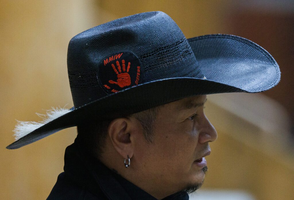 David Yelloweyes sports a Missing and Murdered Indigenous Women (MMIW) patch on his hat as he talks about his experience.