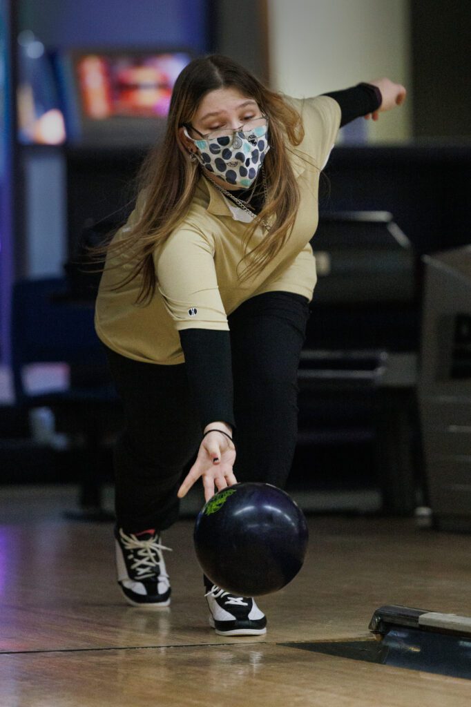 Meridian High bowler Emma Hill practicing at Mt. Baker Lanes with a mask on.