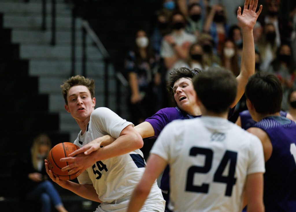 Squalicum's Peter Albert gets tangled with Anacortes’ Jacob Hayes.