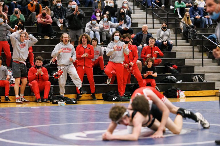 Bellingham wrestlers react during a match between Conor Rodriguez-Stiff and Squalicum’s Jonah Papetti at Squalicum High School on Jan. 25.