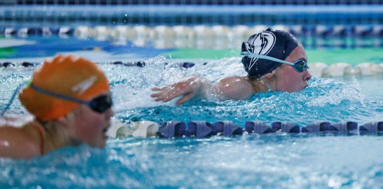 Squalicum’s Celeste Fisher, right, and Blaine’s Sylviw Lausier swim side by side.