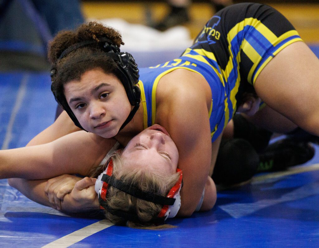 Ferndale’s Malia Welch pins her opponent on the blue mat.