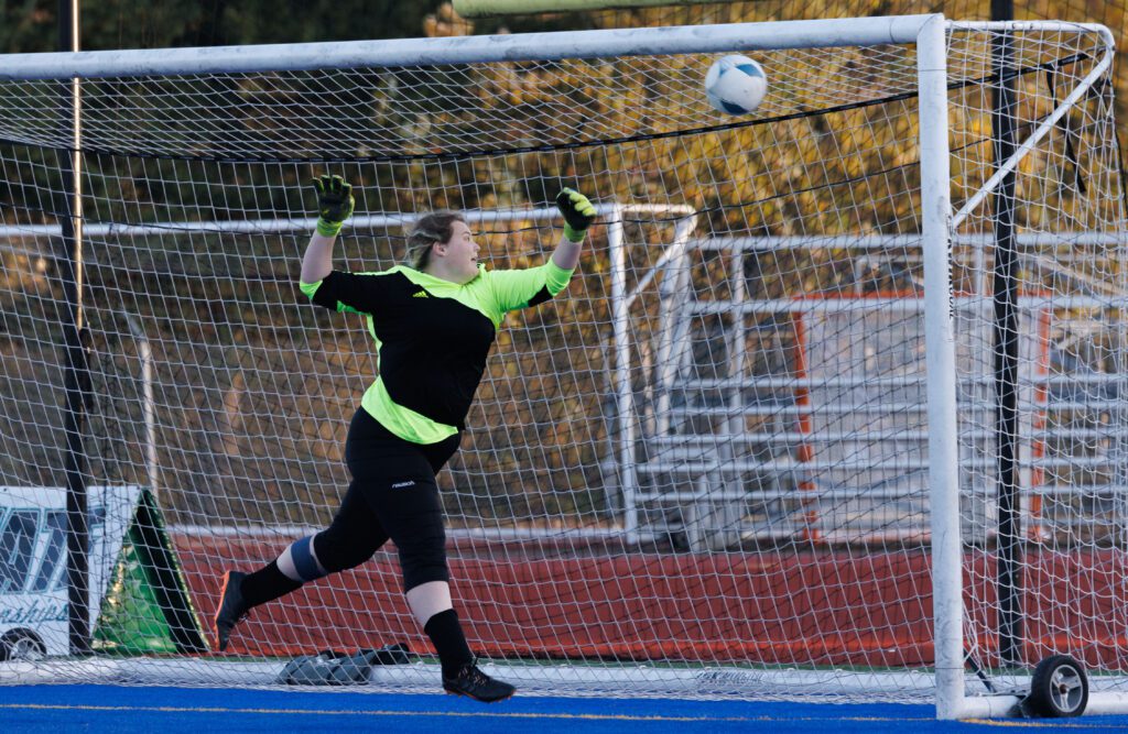 Lynden Christian's Jessa Wynstra turns too late to the ball reaching the goal.