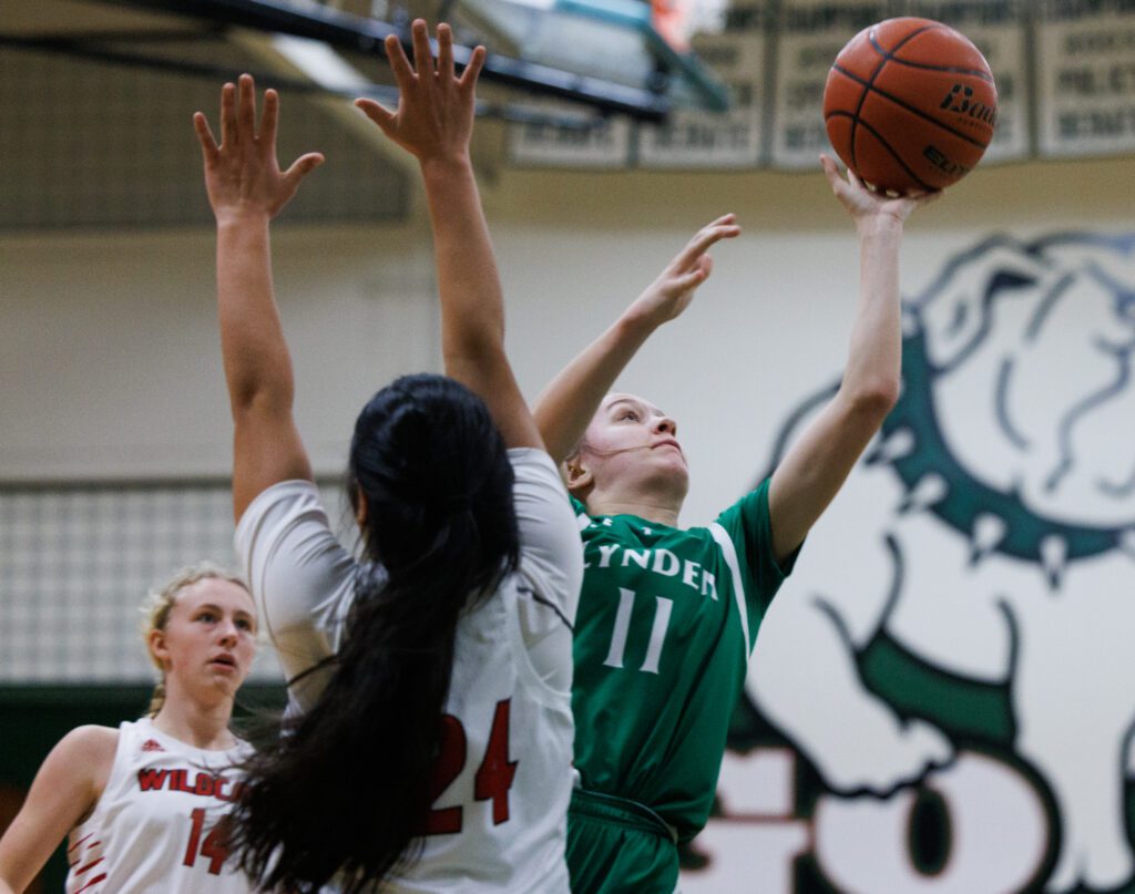 Lynden's Mallary Villars leaps past a defender with the ball in hand.