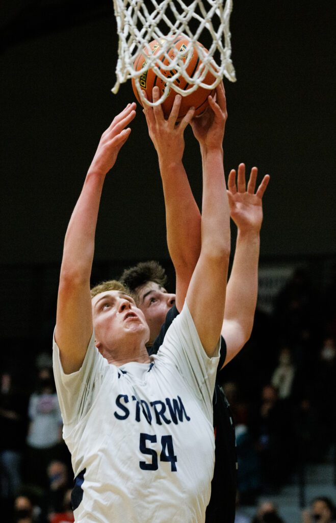 Squalicum's Peter Albert and Bellingham's Henry Sheldrup battle for the rebound.