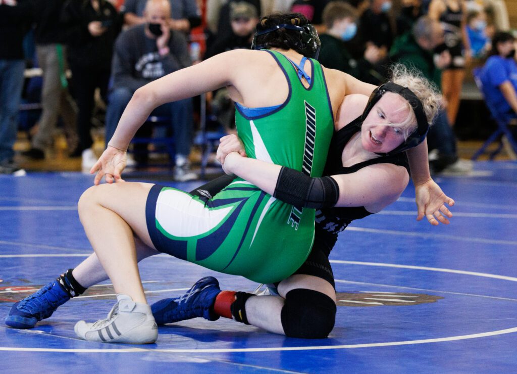 Bellingham's Tegan Blackburn throws down Woodinville's Soobin Jones backwards towards the mat.