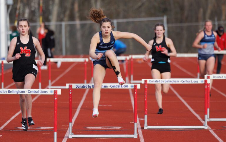 Squalicum's Hazel Gleckman jumps ahead of the competition at Civic Stadium on March 30.