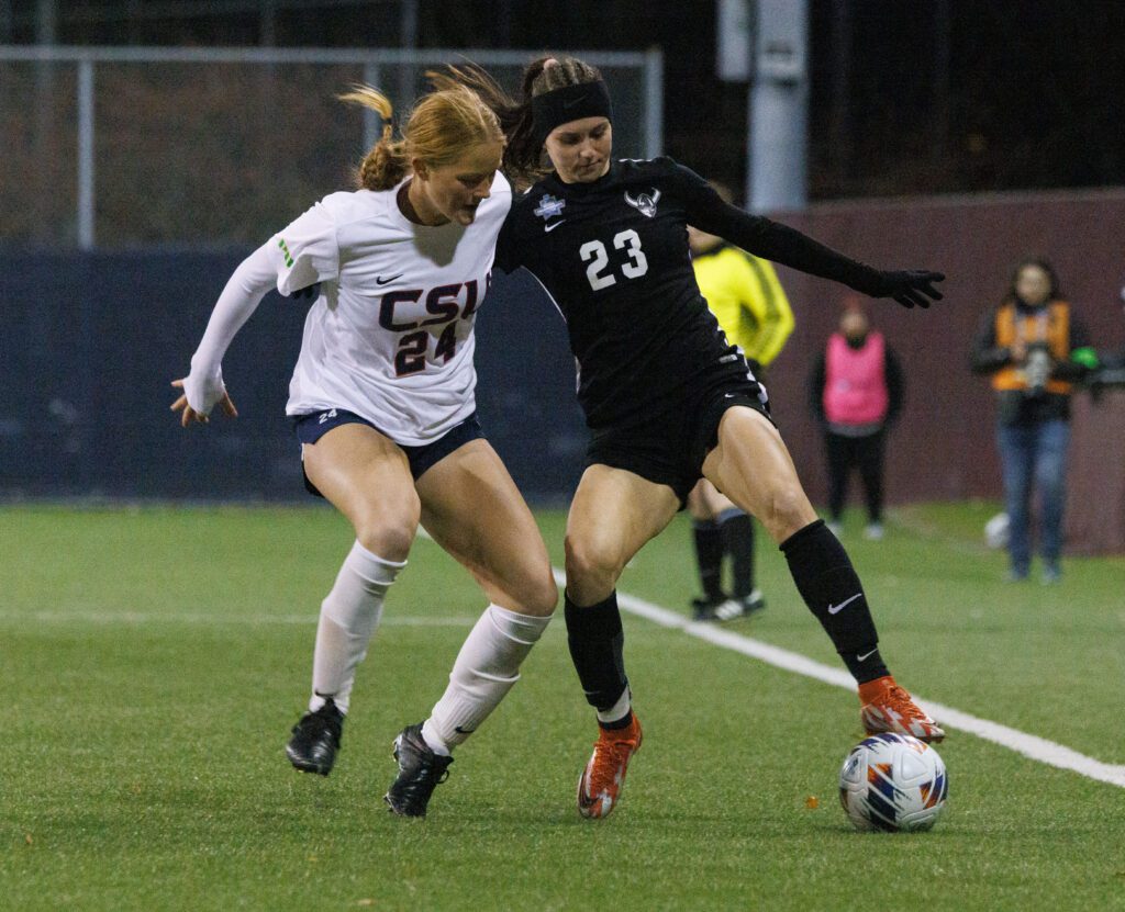 Western Washington University’s Estera Levinte battles to keep the ball in bounds as a Columbus State defender puts pressure on her from the other side.