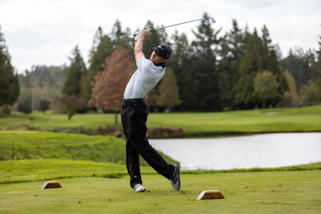 Western's Aidan Thain with the golf club swung over him.