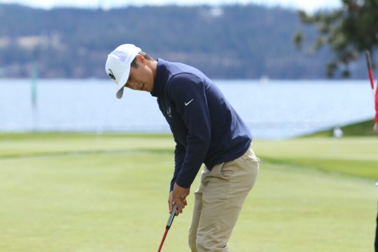 Western Washington University senior Jordan Lee gets ready to putt on the golf course.