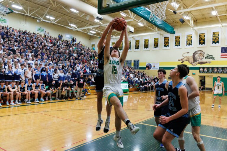 Lynden’s Trey Smiley comes down with the rebound against Lynden Christian's Crew Bosman on Jan. 28.