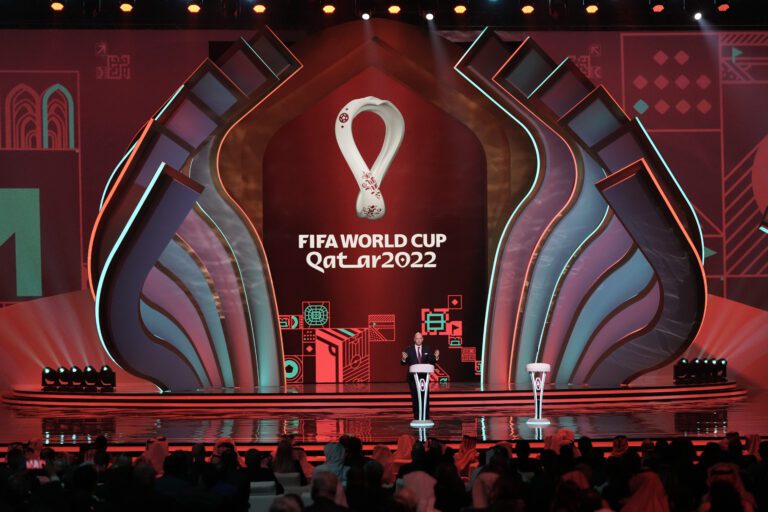 FIFA President Gianni Infantino speaks before the 2022 soccer World Cup draw on stage.