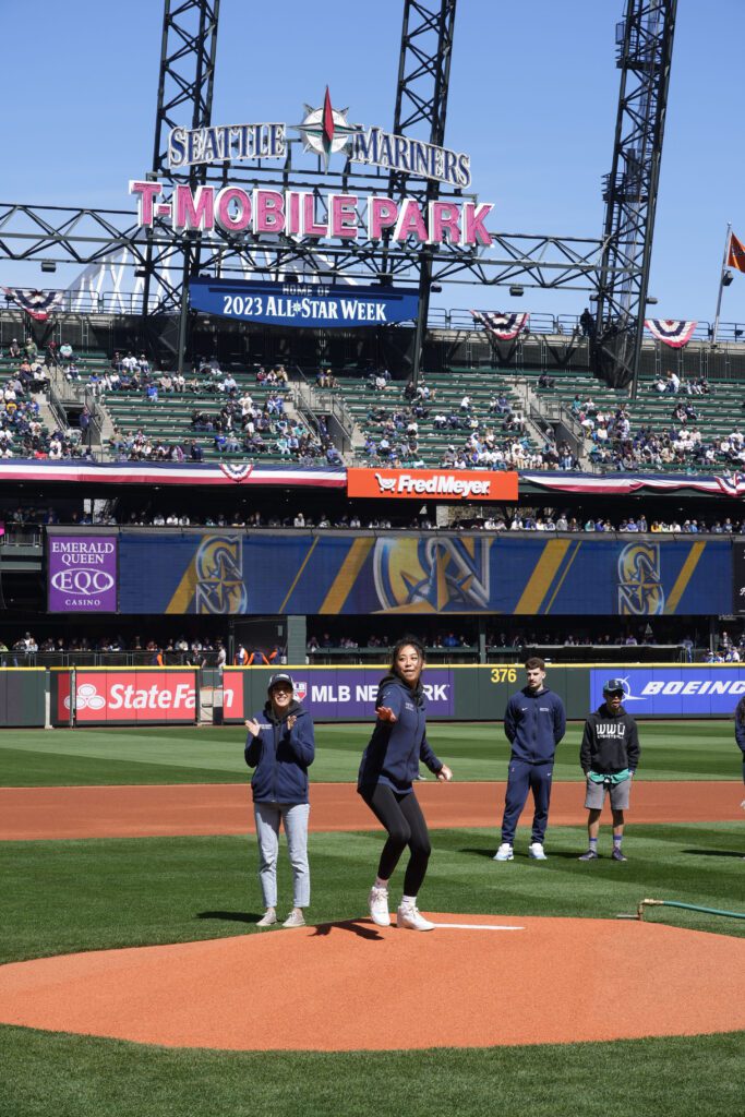 Western women's basketball senior Dani Iwami throws out the first pitch.