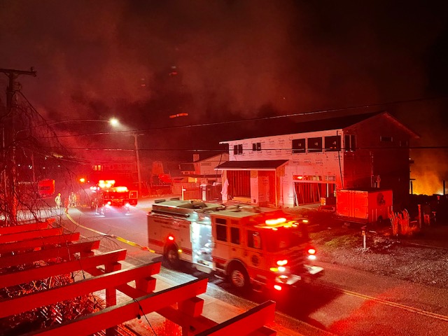 Emergency vehicles rush to the scene, painting the neighborhood red with the bright lights.