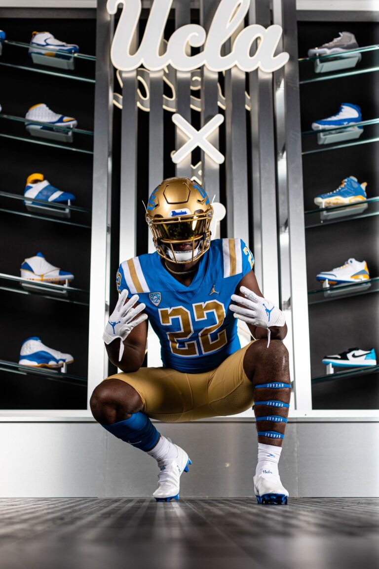 Ferndale running back Isaiah Carlson poses for a photo between racks of shoes.