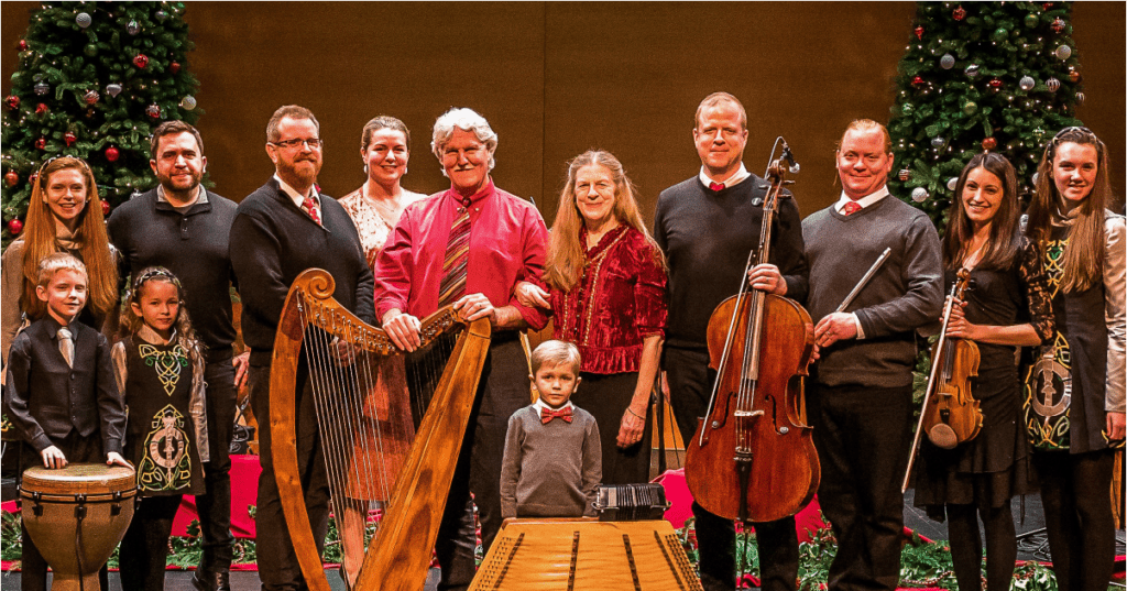 Magical Strings, composed of generations of the Boulding family, pose for a group photo with their respective instruments.