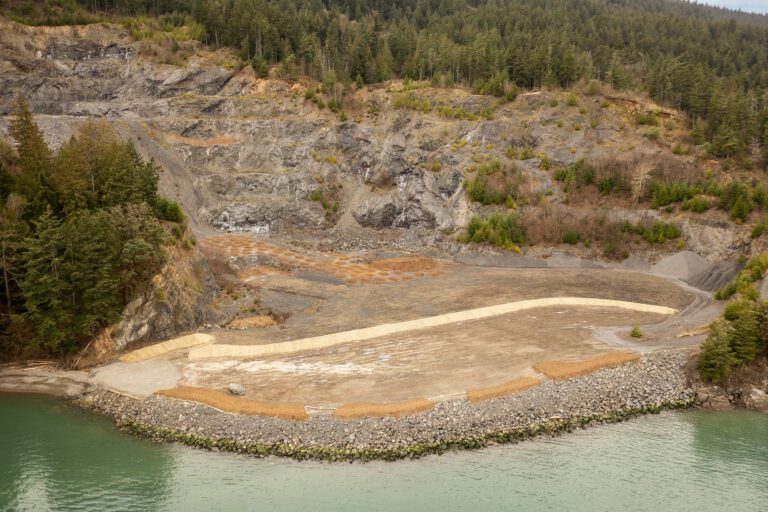 A flattened and cleaned land next to the rocky beaches.