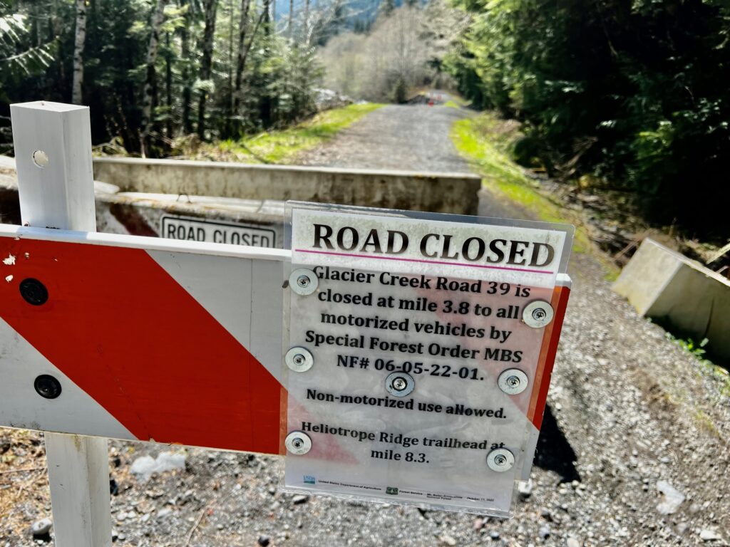 A sign is bolted letting visitors know of the road closure for all motorized vehicles.