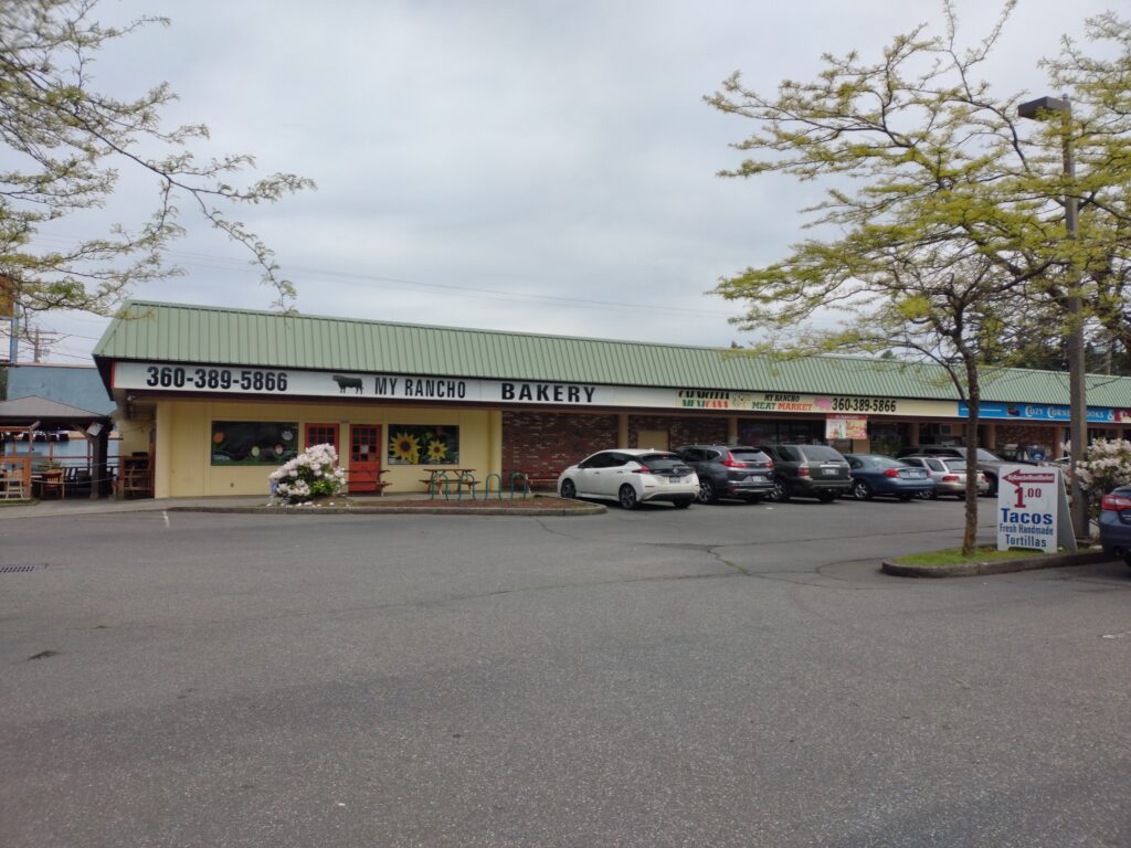 My Rancho restaurant's entrance with multiple cars parked to the side.