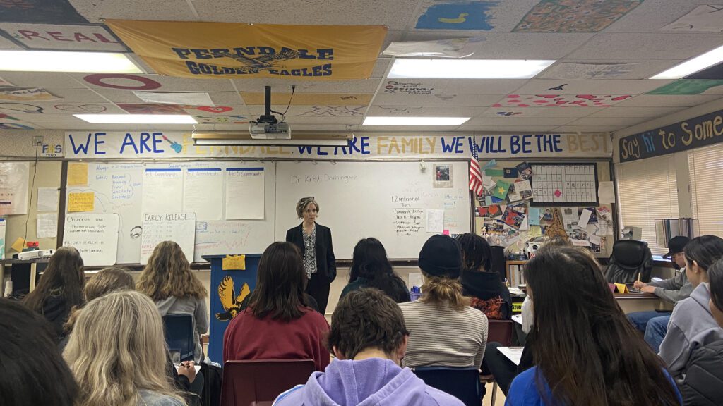 Karin "Kristi" Dominguez meets with students in their classrooms.