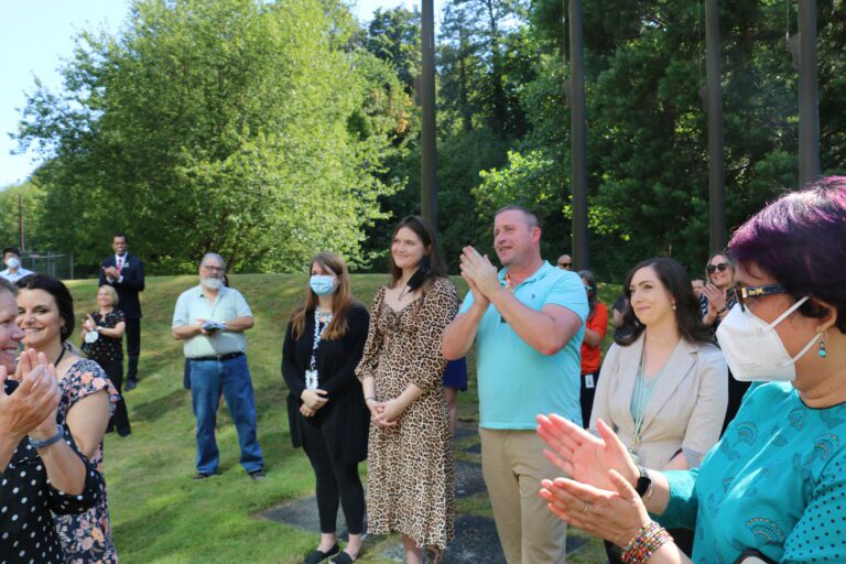 From left, Volunteers of America employees Jacy Wade, Rachel Van Duker, Michael Lane and Courtney Colwell receive a round of applause.