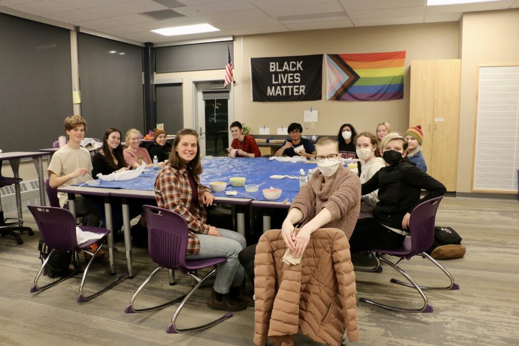 The YEP! club takes a group photo during a meeting.