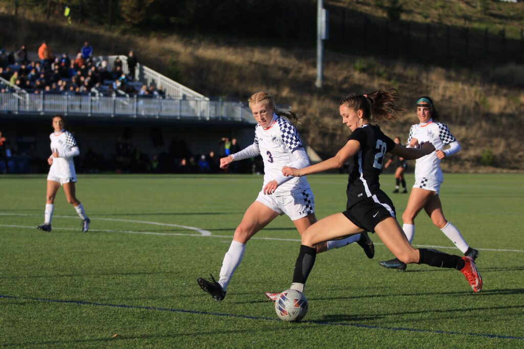 Junior forward Estera Levinte whips in a cross past CSM freshman defender Callie Fuhr.