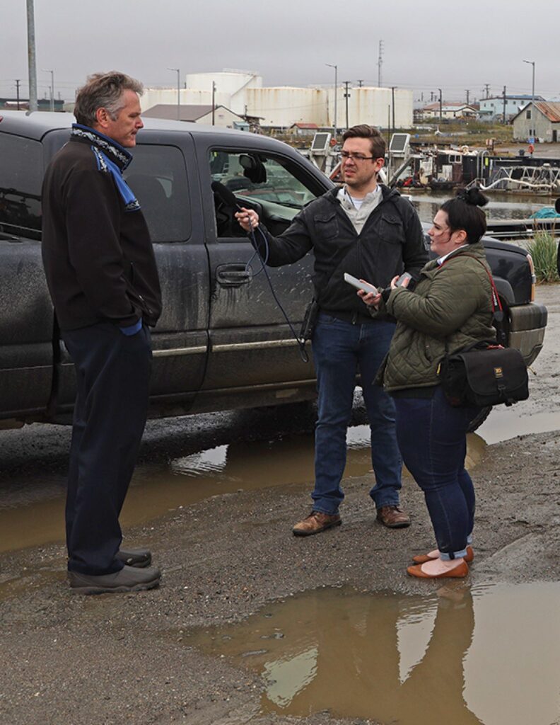 Alaska Governor Mike Dunleavy, left, visited Nome as rain drizzles.