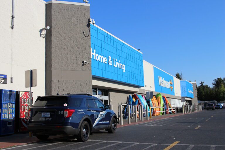 A police vehicle parked in front of Walmart.