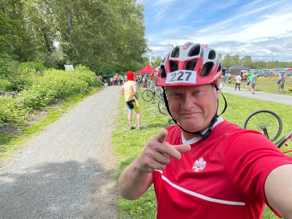 Rob Lawrance sent this selfie to his wife before embarking on the cyclocross leg of Sunday's Ski to Sea race where he is seen pointing tot he camera as other bikers get ready nearby.