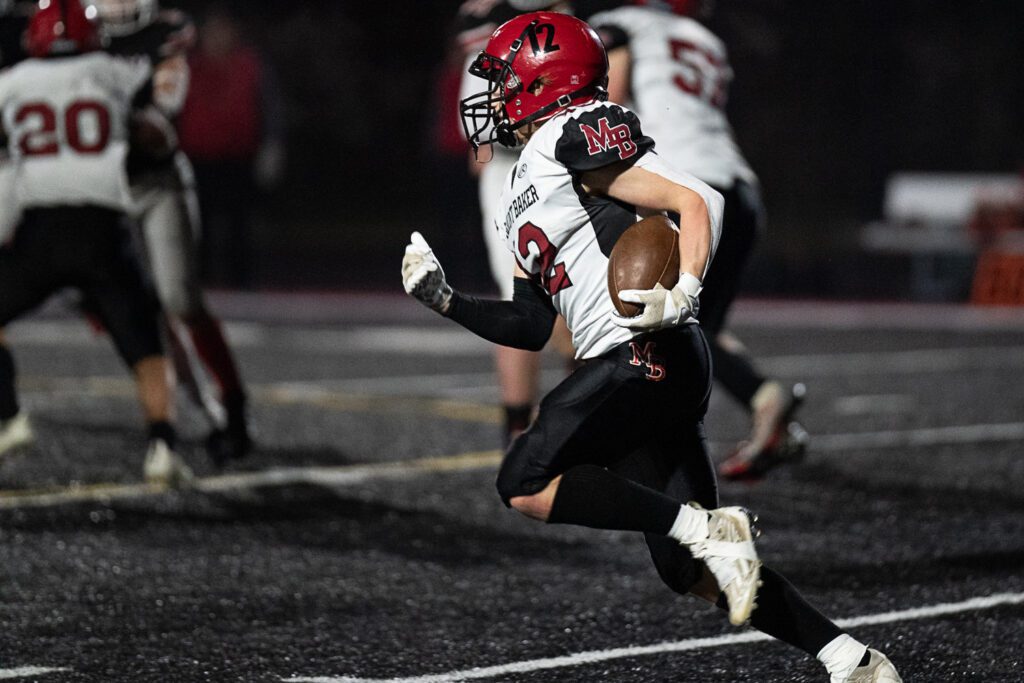 Mount Baker running back Landen Hanstead runs to the outside with the ball.