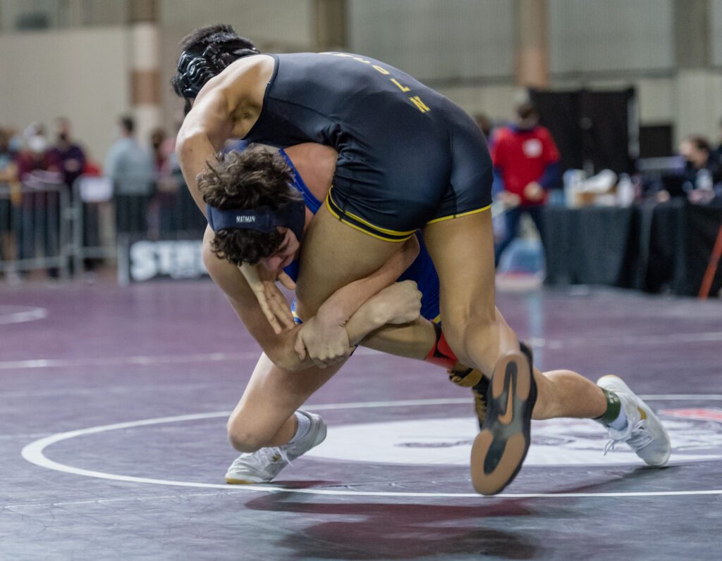 Ferndale's Adrian Finsrud shoots for a takedown of Lincoln's William Richardson.