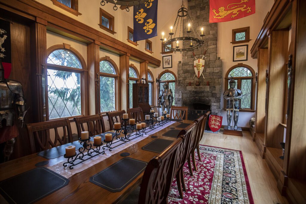 The Great Hall inside High Rock Castle has knights in the corners of the room.