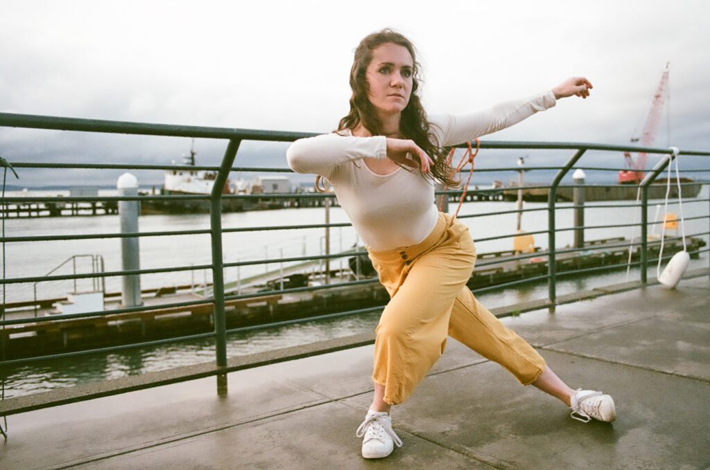 A vintage photo of Marísa Fernandez practicing near the waterfront.