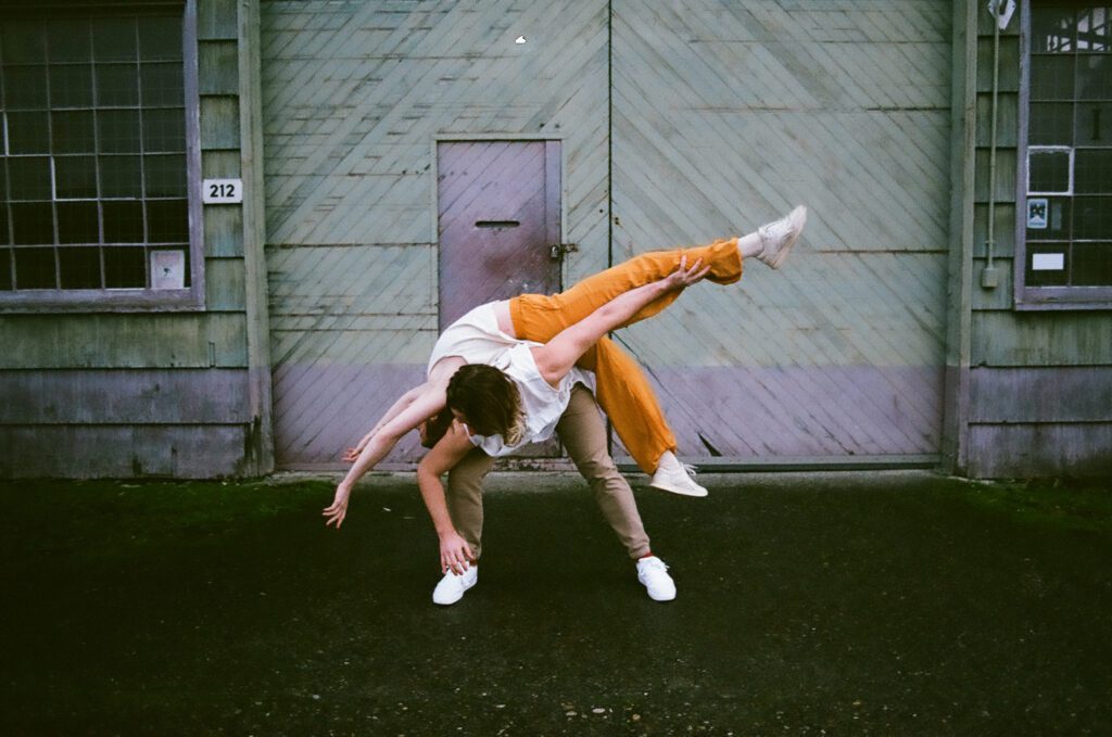 Dancers Soleil Chappelle is slung over Nolan Hoppe-Leonard in "Parched Chalk // I See You."