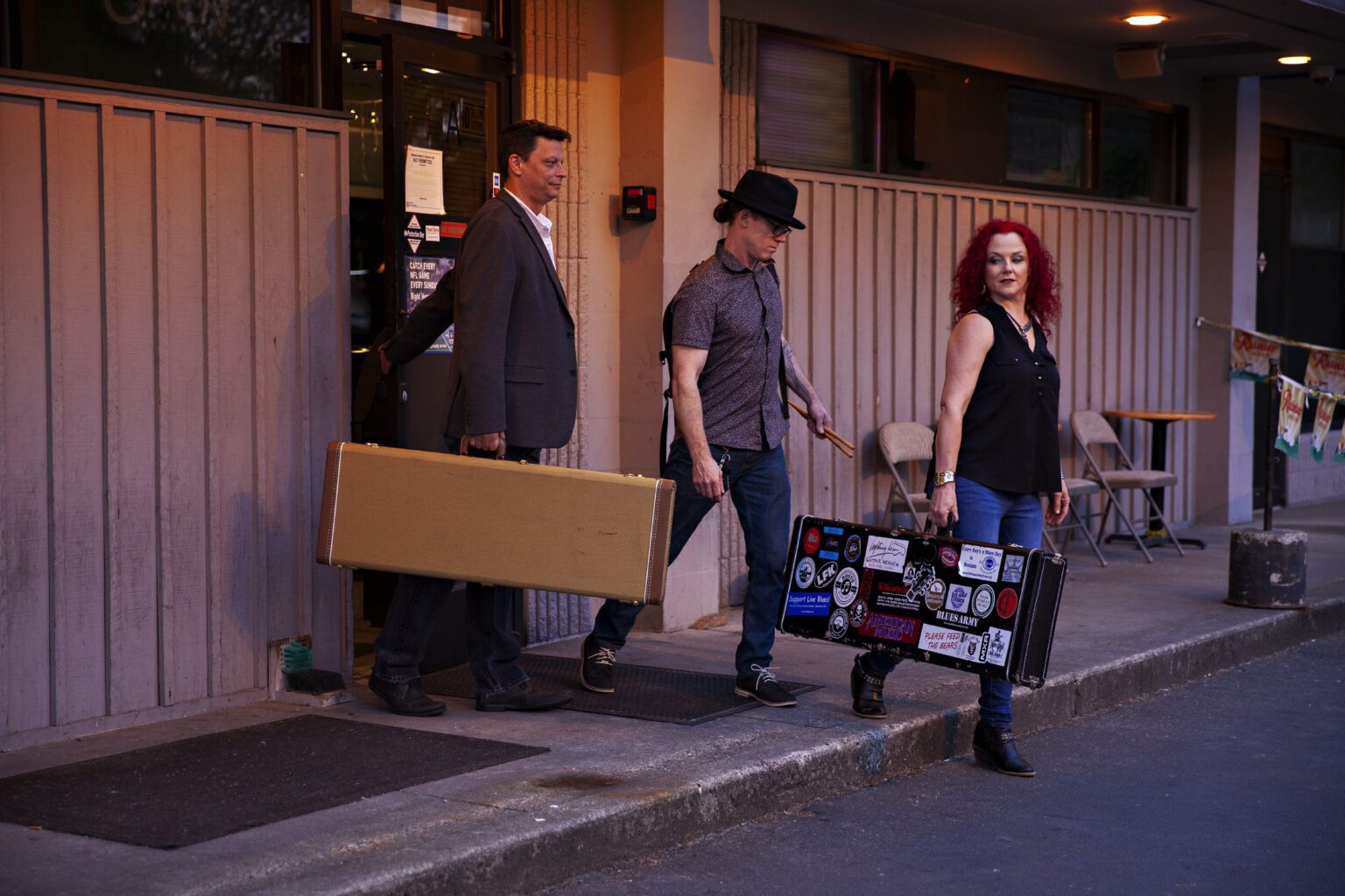 The energetic electric blues of Polly O’Keary and the Rhythm Method band carrying their instruments out the building.