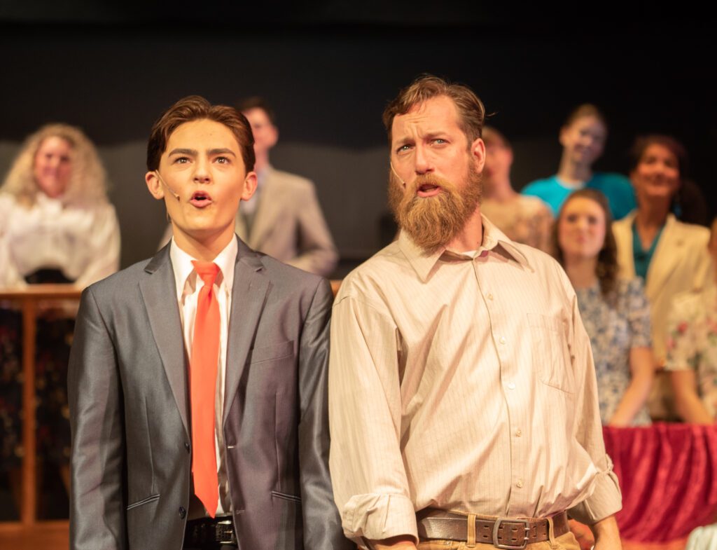 Brayden Bowman and Tim Brown performed as father and son as they look towards the light during a performance.