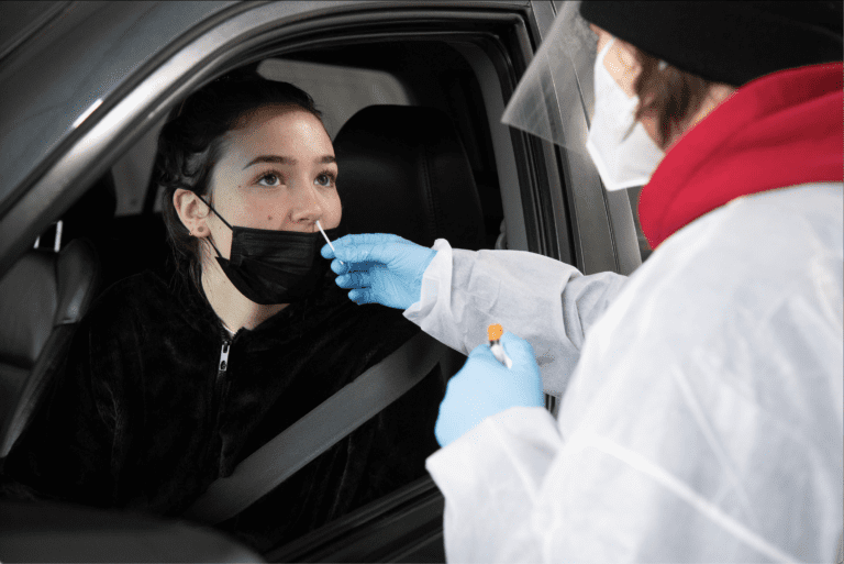 Kaia Little has her nose swabbed while seated in the drivers seat.