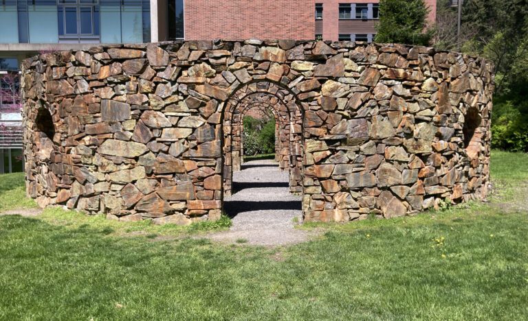 "Stone Enclosure: Rock Rings" is a stone structure with a small passage.