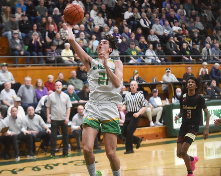 Lynden's Anthony Canales looks for a layup as the crowds behind him watch in anticipation.