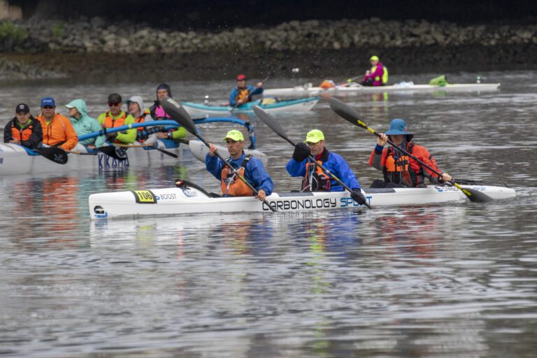 Kevin Olney, Paul Clement and Jeff Maloney of Team Convergence Zone from Bellingham row side by side during the race.