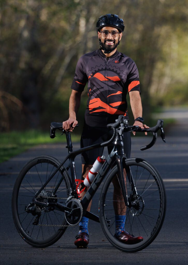 Thirin Udawatta standing next to his bike.