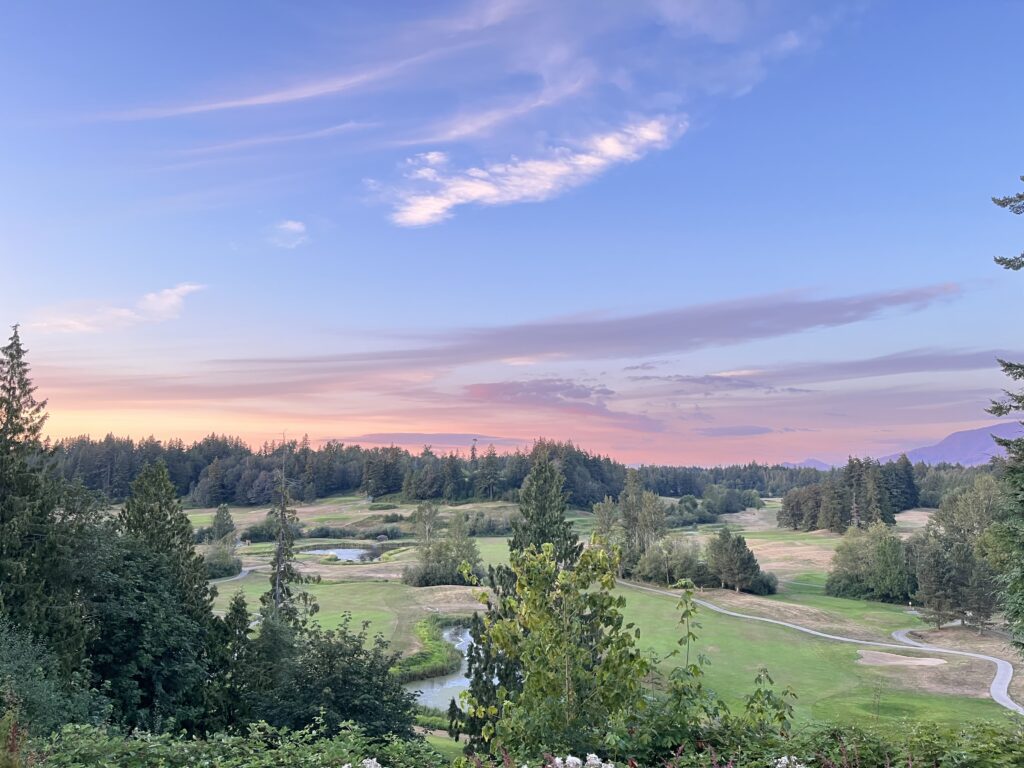 The sun set paints the sky pink and purple.